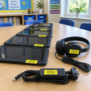 School tablets and chargers marked with yellow property labels