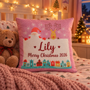 Pink name cushion on a child's bed on Christmas Eve