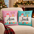 Pink and turquoise personalised cushions with children's names on an armchair