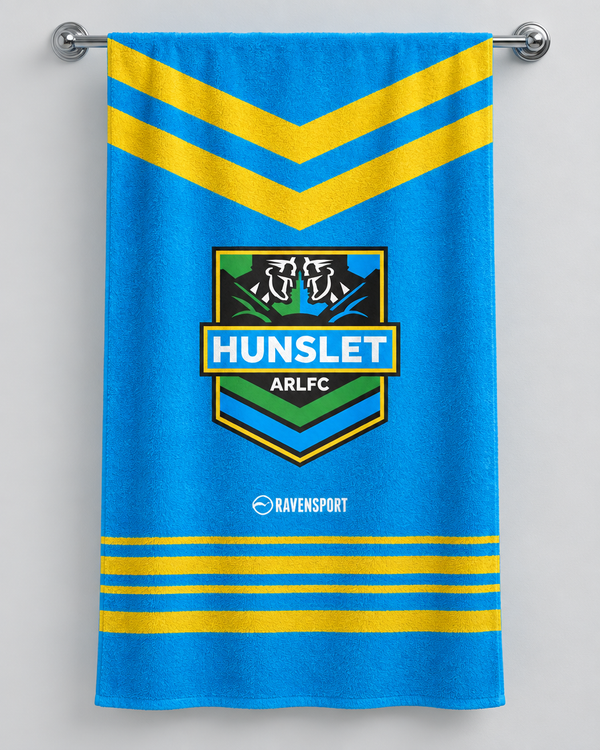 Hunslet ARLFC personalised rugby bath towel hanging on a towel rail
