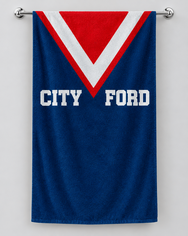 Sydney Roosters personalised rugby bath towel hanging on a towel rail