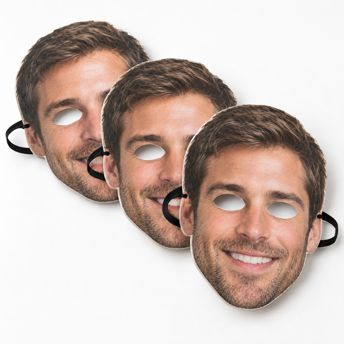 Personalised face masks printed with a photo of a smiling man, three card masks with eye holes and elastic