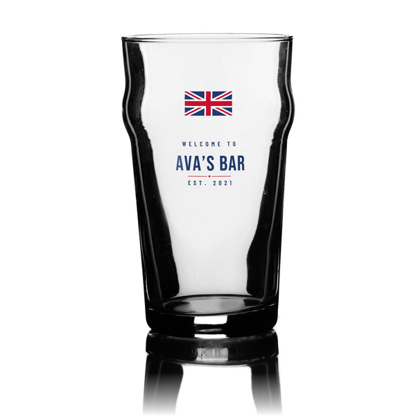 Personalised Union Jack bar pint glass with a Union Jack flag, bar name and year in navy and red, UV DTF printed on a clear 20oz nonic pint glass
