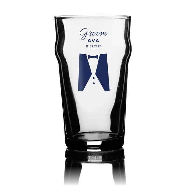 Personalised wedding party pint glass for the Groom in navy with name and wedding date, UV DTF printed on a clear 20oz nonic pint glass