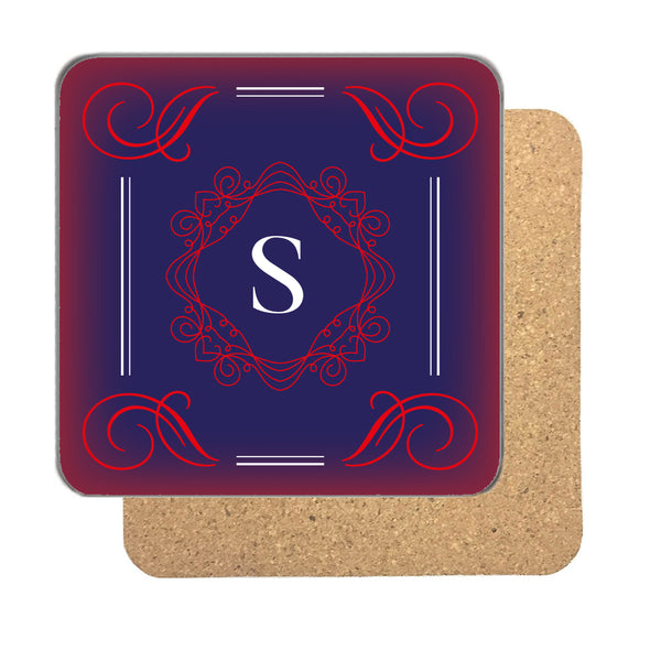 Personalised initial coaster with a large white serif letter inside a red monogram frame on midnight blue